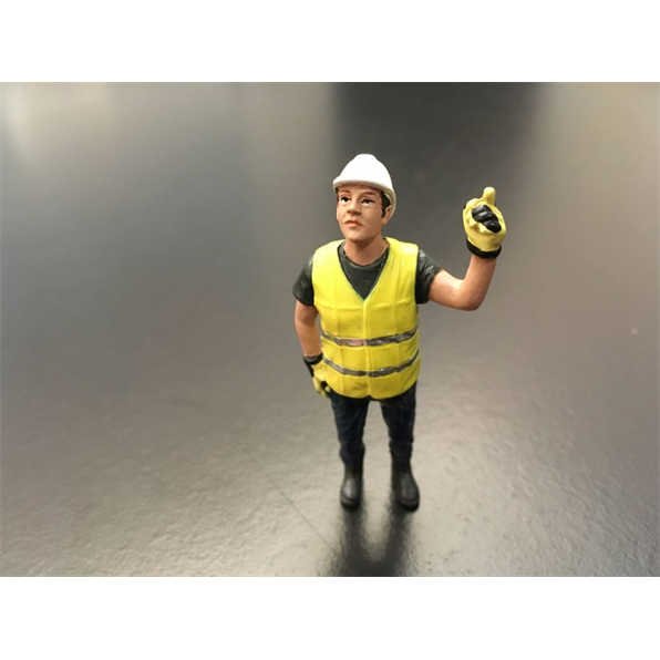Worker directing hoist Yellow safety jacket with helmet